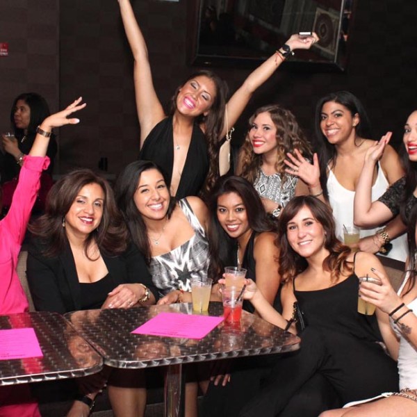 Christine Evans, Anya Ayoung-Chee sitting posing for the camera