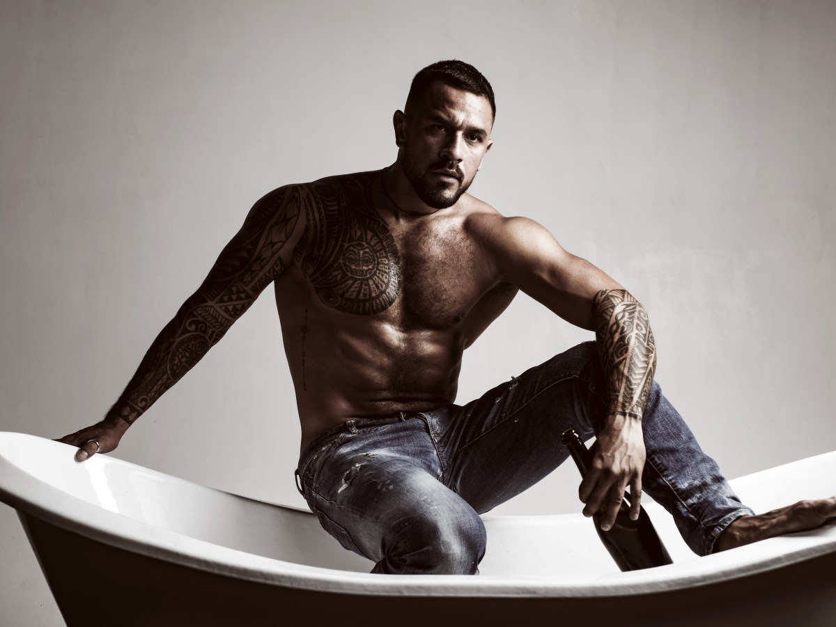 That means its bath time. Strong latino man with tattoo on muscular torso sitting in bath. Atheltic hispanic man drinking wine in bath. Wine and bath are the key to relaxation for him